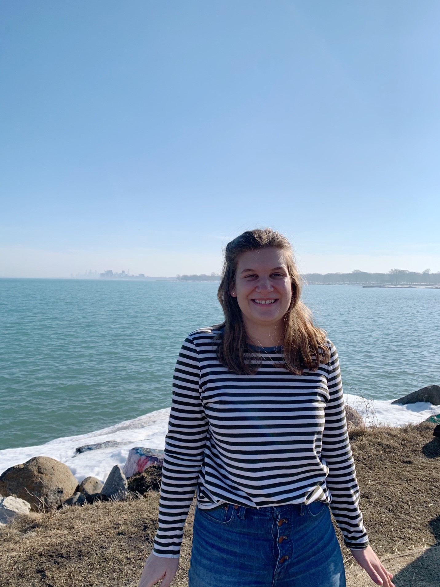 Image of Ashley Goldsmith standing in front of the lake